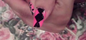 Paint your nails with a neon pink and black design