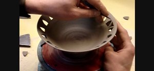 Pierce carve a clay pottery bowl
