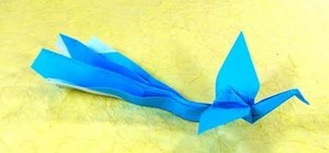 Fold a traditional origami phoenix with long tail feathers