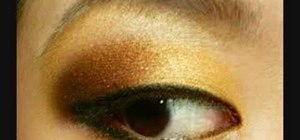 Apply MAC gold, orange, and copper eye makeup