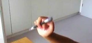 Perform the double charge pen spinning magic trick