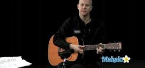 Play "Stand By Me" by Ben E. King on acoustic guitar