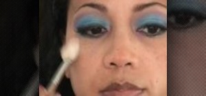 Create a bohemian blue makeup look for dark skin