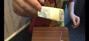 Perform the pen pentrating real money magic trick