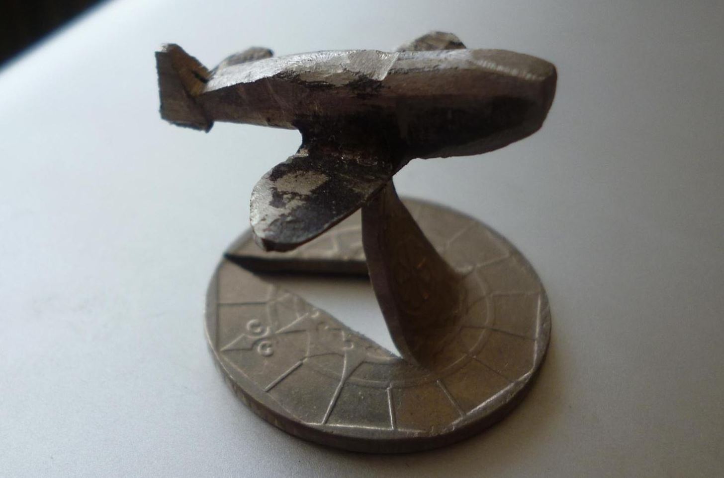 How to Sculpt Your Spare Change into a Badass Miniature Jet Fighter Plane