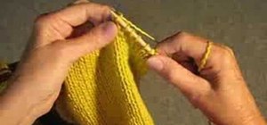 Fix a knitting mistake by unravelling yarn