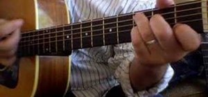 Play "Sitting, Waiting, Wishing"on acoustic guitar