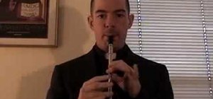 Play a roll on a tin whistle in an Irish reel