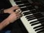 Play a 12-bar blues song on the piano