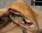 Cook a calzone with spinach, provolone and salami filling