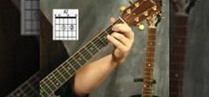 Play the A7 chord on the acoustic guitar
