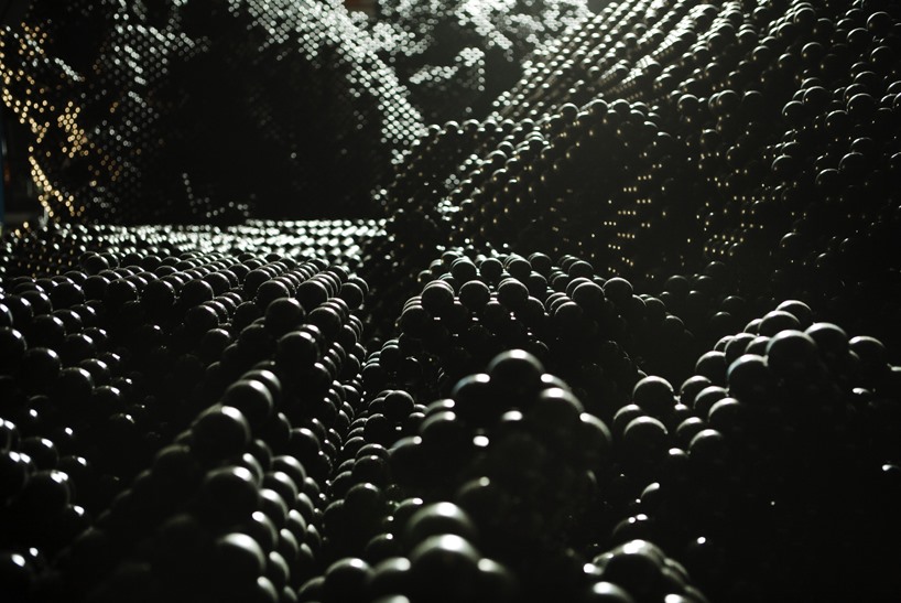 Massive Geometric Sculpture Resembles Tsunami of Black Caviar