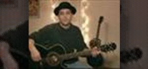Play "Blue Christmas" on the acoustic guitar