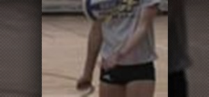 Serve underhand in a game of volleyball