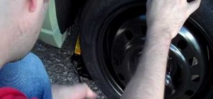 Change a flat tire on your automobile quickly