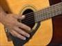 Play an EAB chord progression on the guitar