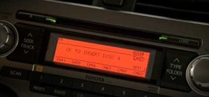 Load a CD into the 2010 Toyota 4Runner audio system