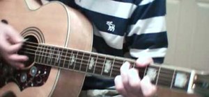 Play "Starman" by David Bowie on acoustic guitar