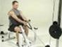 Tone arms with a cable preacher curl exercise