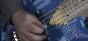Guy plays 5 String LEGO Bass Guitar