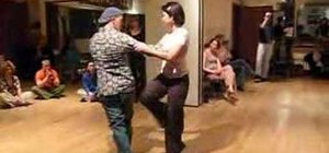Perform the overturned back sacada Tango move