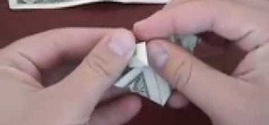 Origami a dollar bill into a heart
