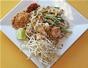 Make Pad Thai (stir-fried rice noodles) with chicken and shrimp