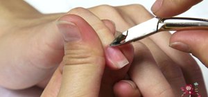 Remove fingernail cuticles safely with cuticle oil and cuticle pusher