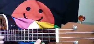 Play "Let it Be" by the Beatles on ukulele