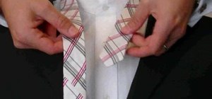 Tie a necktie with a double (or full) Windsor knot