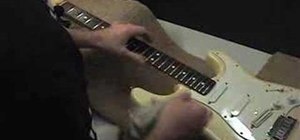 Change strings on a guitar with a fixed bridge