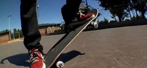 Do a fakie kickflip on a skateboard