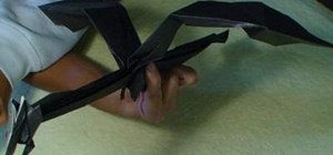 Fold an origami dragon posed in flight