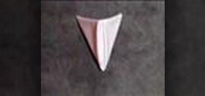 Fold a napkin into a pyramid