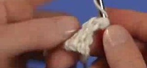 Decrease two open squares with the crochet filet