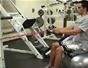 Do a seated row back exercise with resistance tubing