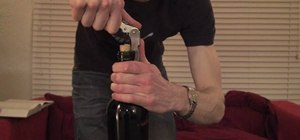 Open a bottle of wine with a waiter's corkscrew