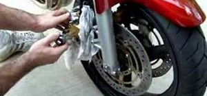 Change the brake pads on a Honda 919 motorcycle