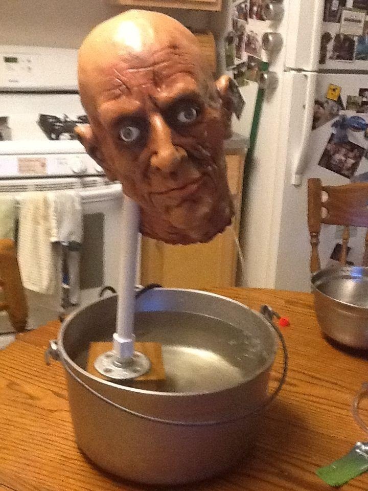 DIY Decapitated Head Drinking Fountain: The Perfect Way to Serve Blood-Red Punch on Halloween