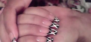 Paint nails in a black, pink, and white art design