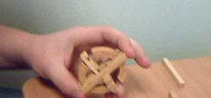 Solve the classic wooden ball puzzle
