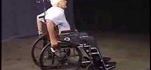 Perform a wheelchair wheelie
