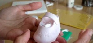 Make a gumpaste pair of baby shoes