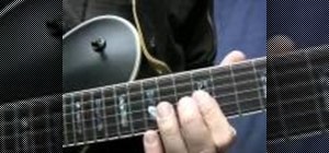 Play a simple four-bar rock'n'roll-style guitar solo