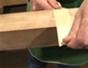 Use a band saw to cut a tapered leg