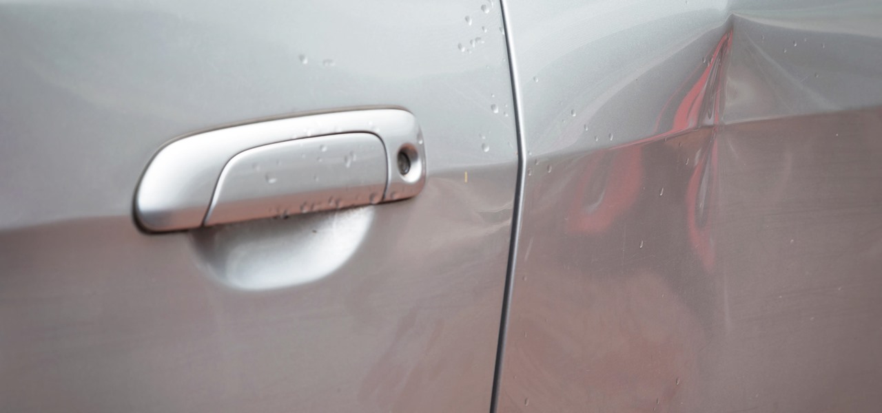 Fix a Huge Dent in Your Car at Home Without Ruining the Paint Job