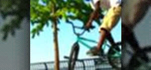 Perform a barspin on a BMX bicycle