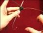Do magic loop knitting with a large cable needle