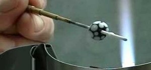 Control a mandrel spinner for lampworking glass beads