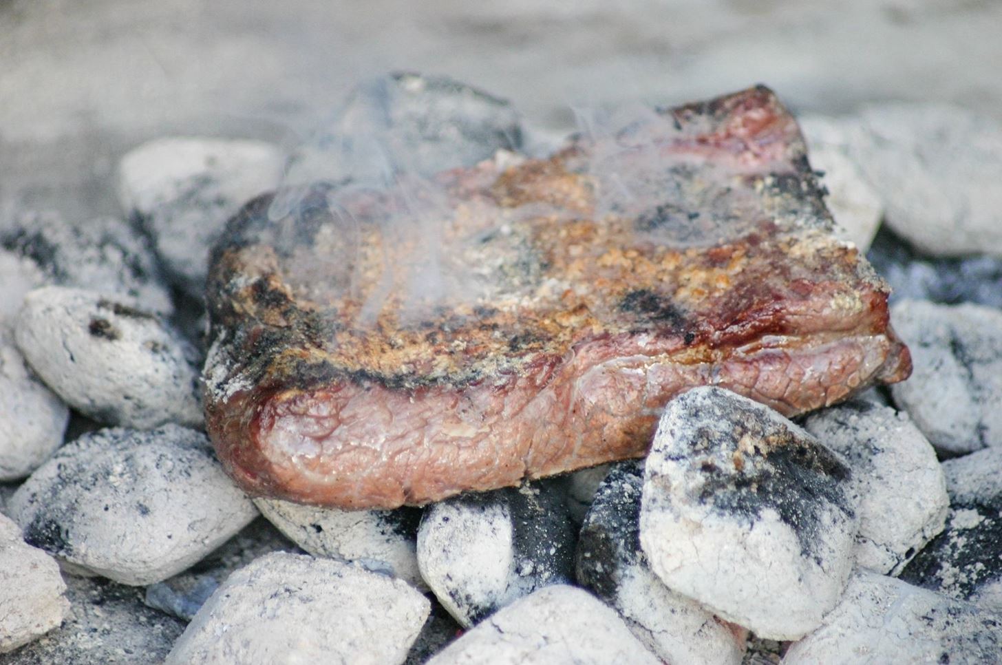 Cook Meat Directly on the Coals for Intense, Fire-Seared Flavor